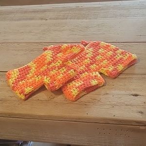 2 Hand crocheted orange variegated potholders.